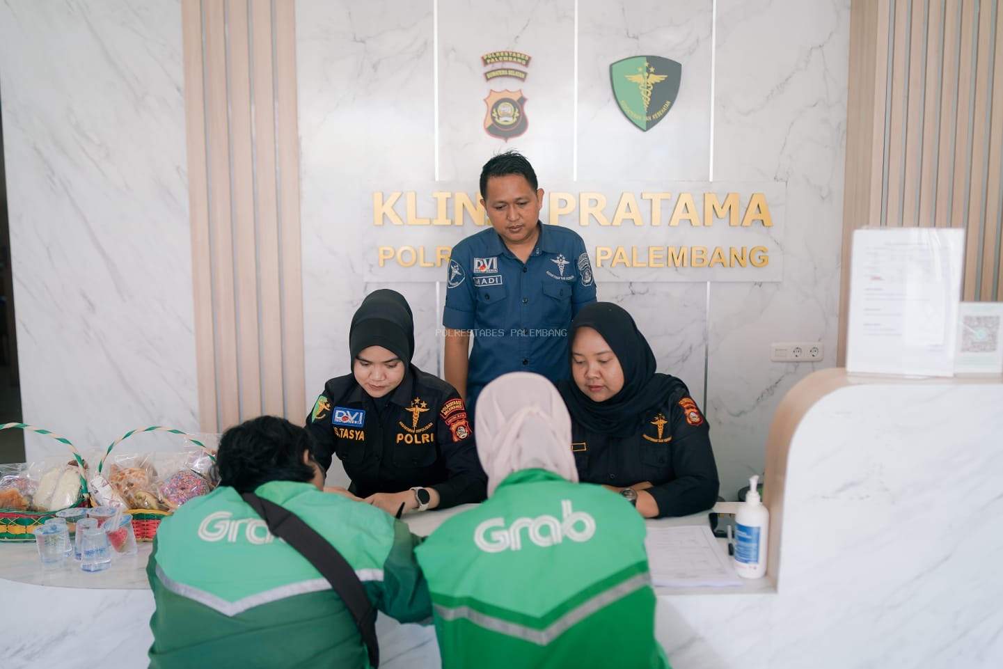 Polrestabes Palembang Gelar Pemeriksaan Kesehatan Gratis bagi Pengemudi Ojol, Sambut HUT Bhayangkara ke-79